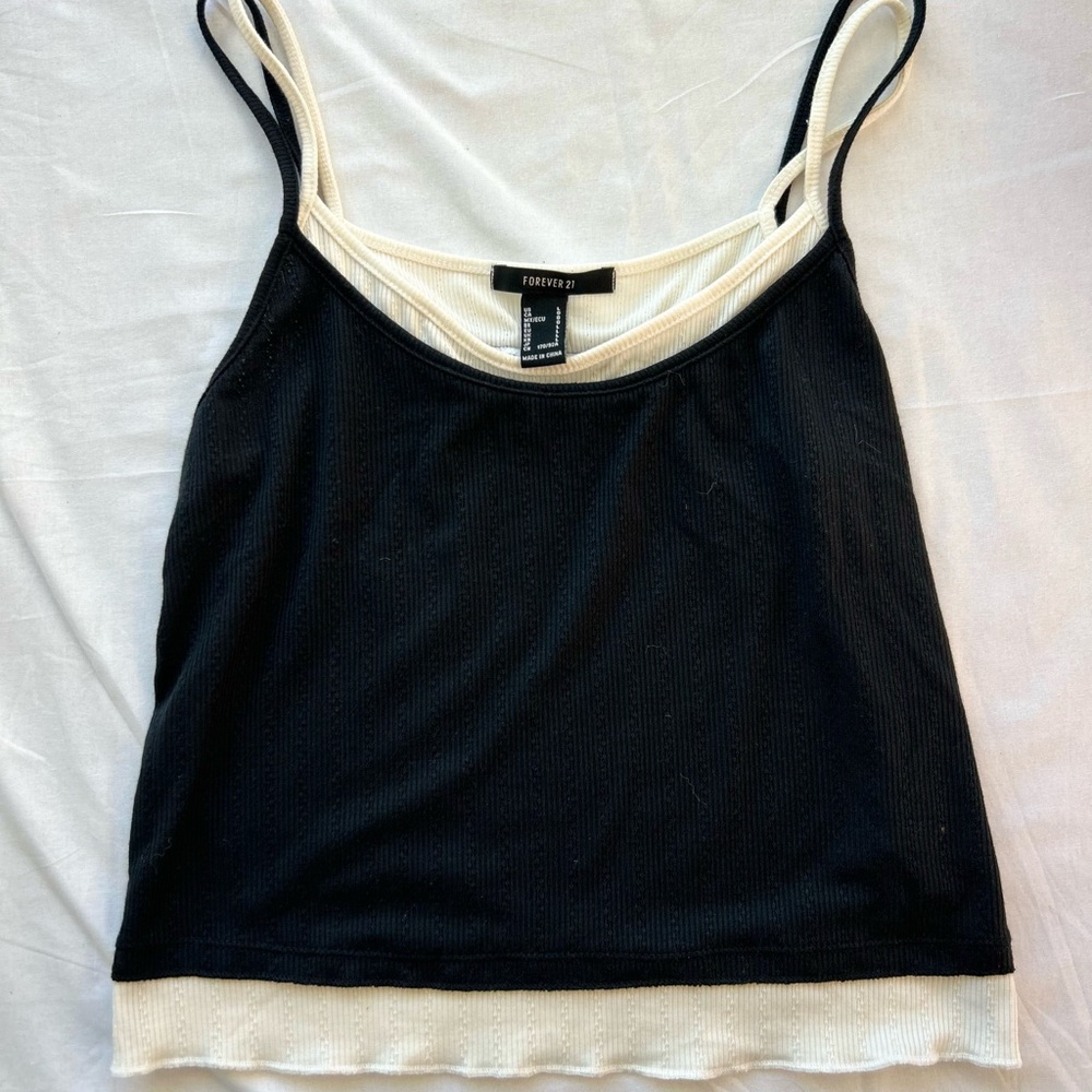 This cropped black and white tank is the perfect addition to your wardrobe.